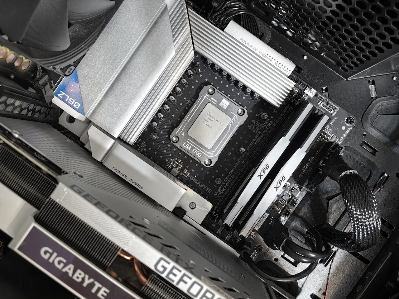 Interior view of a high-performance PC build featuring a Gigabyte motherboard and components.