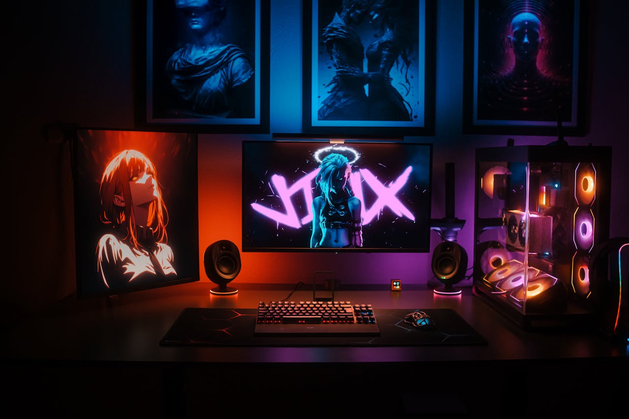 A dynamic gaming setup showcasing neon LED lights and anime-inspired art, perfect for tech enthusiasts.